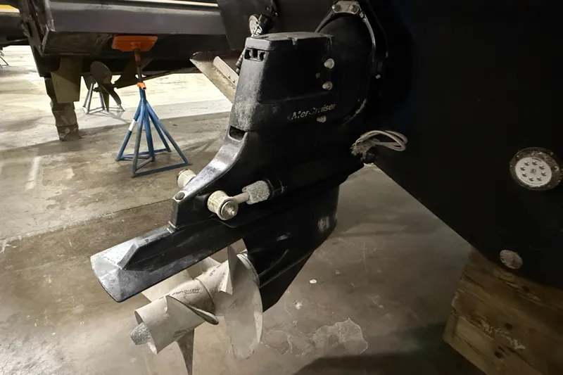  Yacht Photos Pics Close-up of a 2017 Sea Ray Sundancer 330 boat propeller and drive system in a workshop.