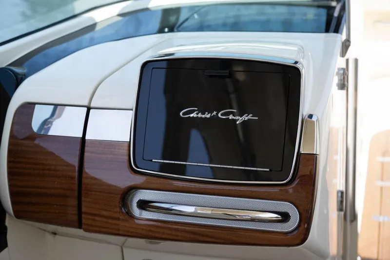 Dunton Yacht Photos Pics 2021 Chris-Craft Launch GT dashboard with wood and chrome accents.