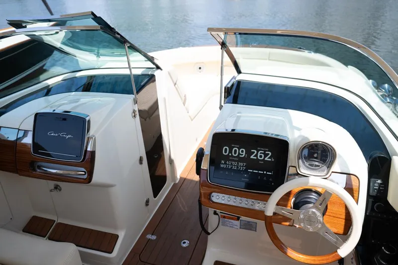Dunton Yacht Photos Pics 2021 Chris-Craft Launch GT boat dashboard with modern controls and wooden accents.