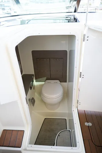 Dunton Yacht Photos Pics 2021 Chris-Craft Launch GT boat interior with compact bathroom and toilet.