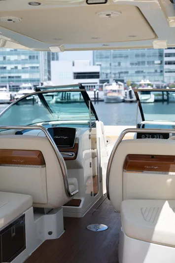 Dunton Yacht Photos Pics 2021 Chris-Craft Launch GT interior with luxurious seating and modern dashboard, docked at marina.