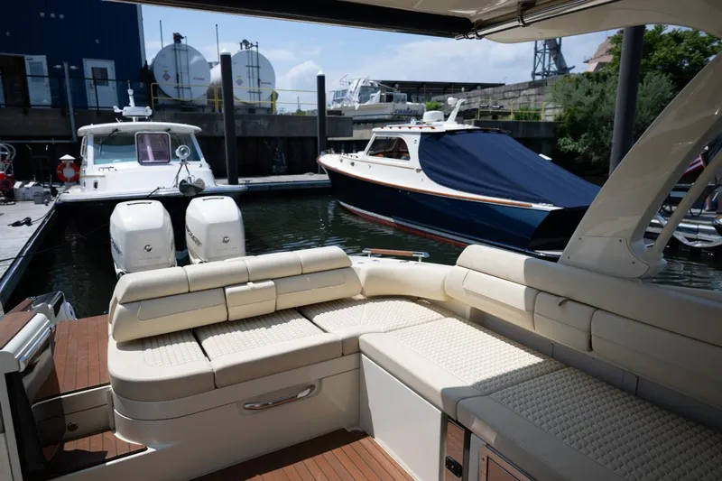 Dunton Yacht Photos Pics 2021 Chris-Craft Launch GT boat with luxurious seating docked at a marina.