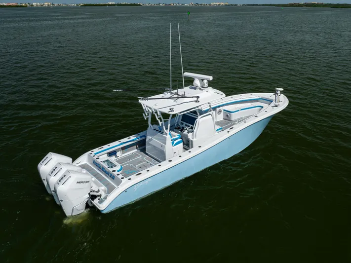  Yacht Photos Pics 2023 Yellowfin 36 Offshore boat on calm water, featuring dual Mercury engines.