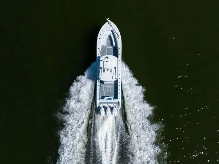  Yacht Photos Pics Aerial view of 2023 Yellowfin 36 Offshore boat cruising on water.