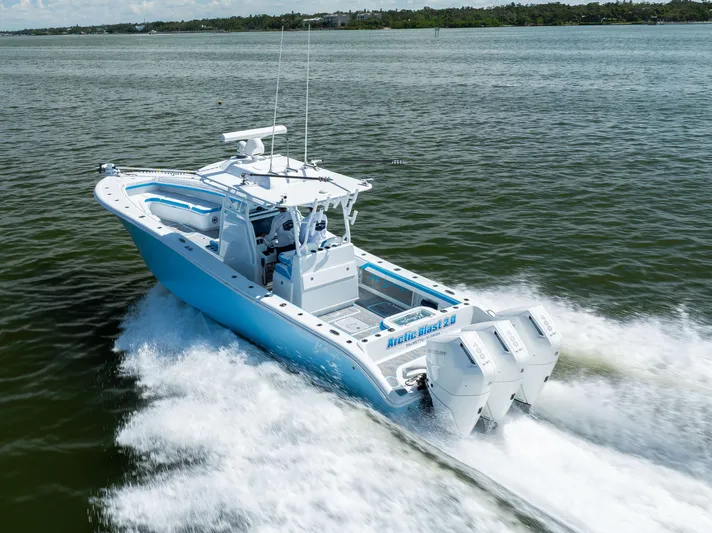  Yacht Photos Pics 2023 Yellowfin 36 Offshore boat cruising on open water, showcasing powerful engines.