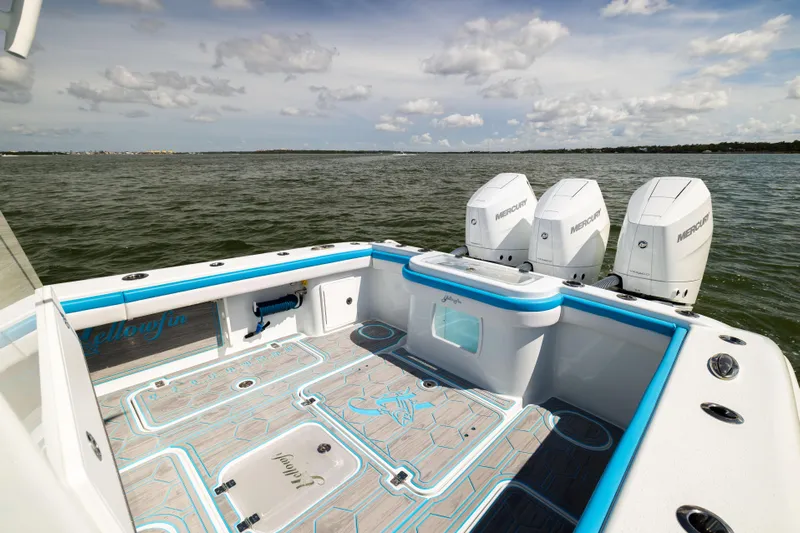  Yacht Photos Pics 2023 Yellowfin 36 Offshore boat with triple Mercury engines on open water.