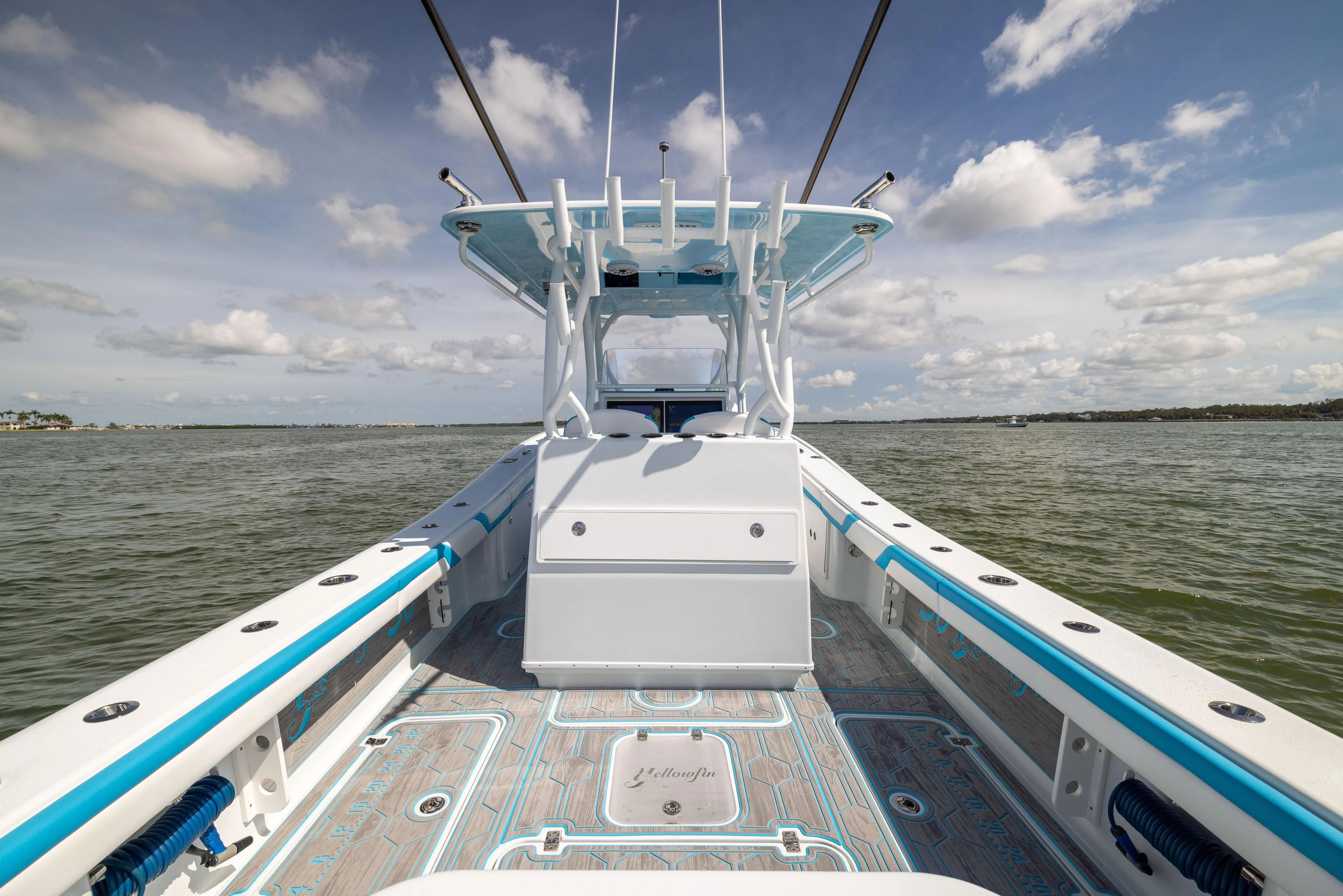  Yacht Photos Pics 2023 Yellowfin 36 Offshore boat on open water, showcasing deck and console.