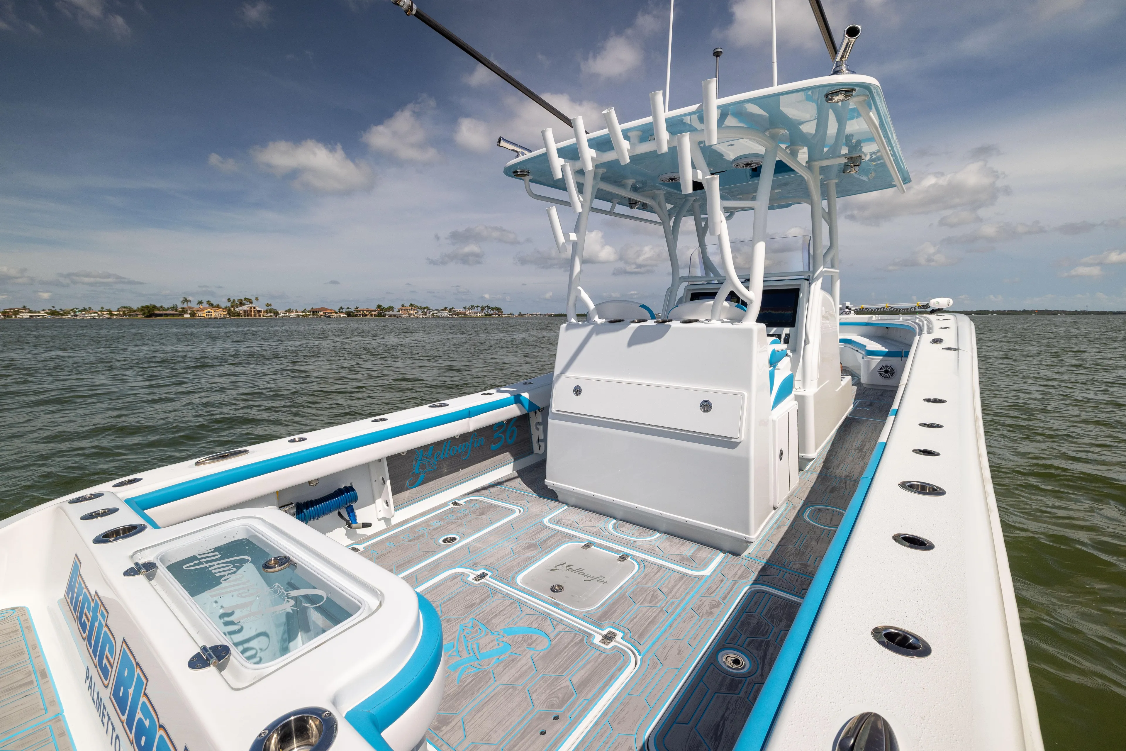  Yacht Photos Pics 2023 Yellowfin 36 Offshore boat on water, featuring spacious deck and modern design.