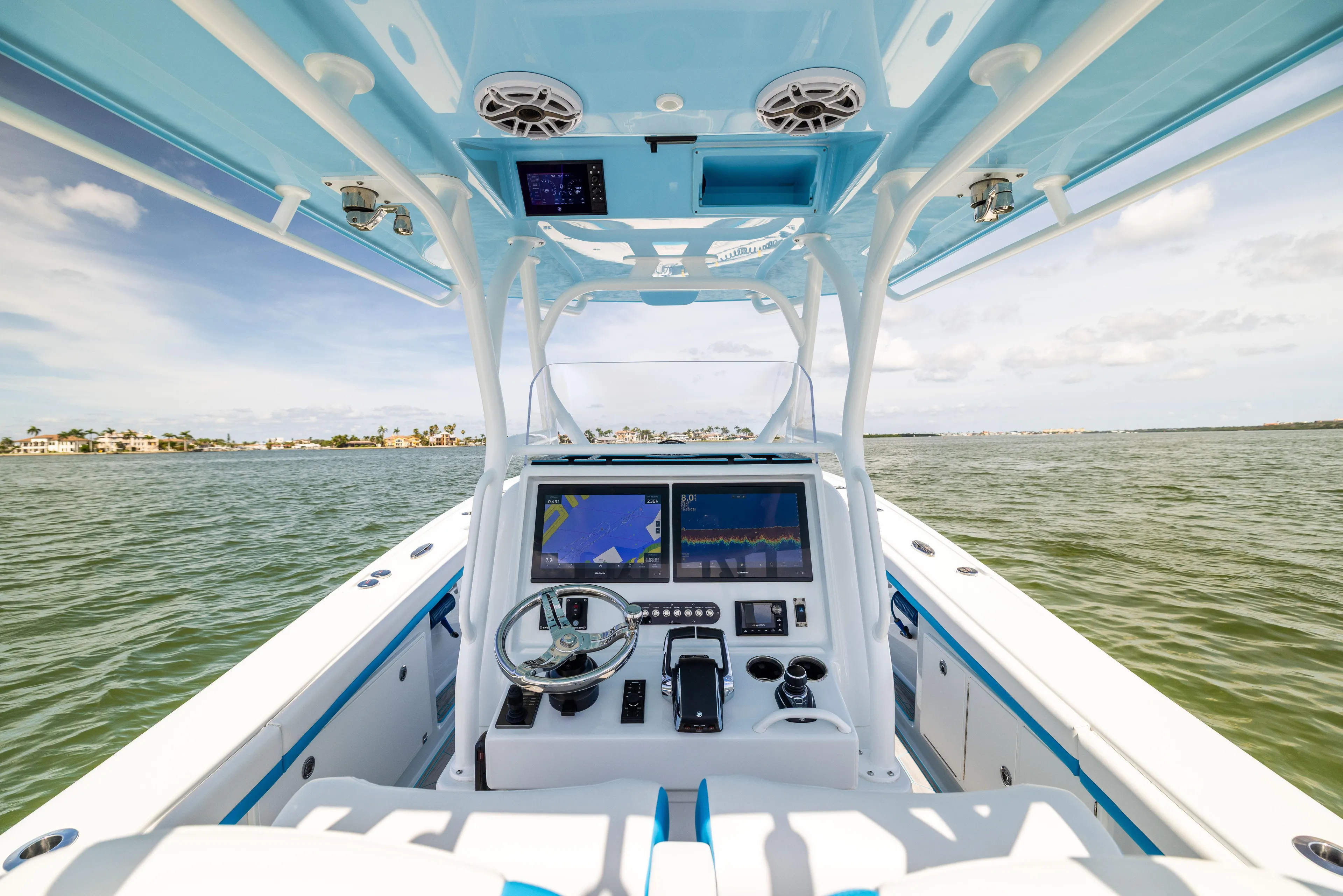  Yacht Photos Pics 2023 Yellowfin 36 Offshore boat interior with advanced navigation system on open water.