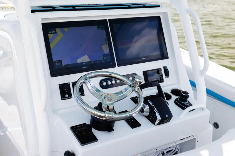  Yacht Photos Pics 2023 Yellowfin 36 Offshore boat console with dual Garmin displays and steering wheel.