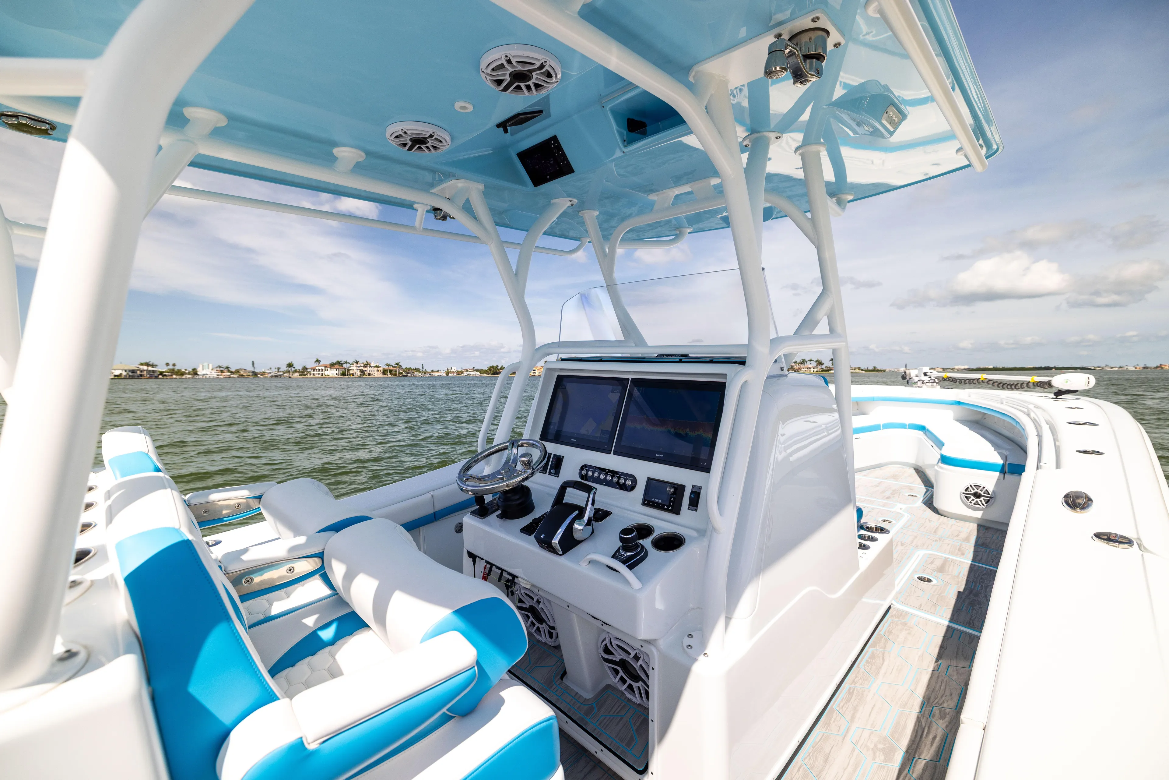  Yacht Photos Pics 2023 Yellowfin 36 Offshore boat interior with modern controls and blue accents on open water.