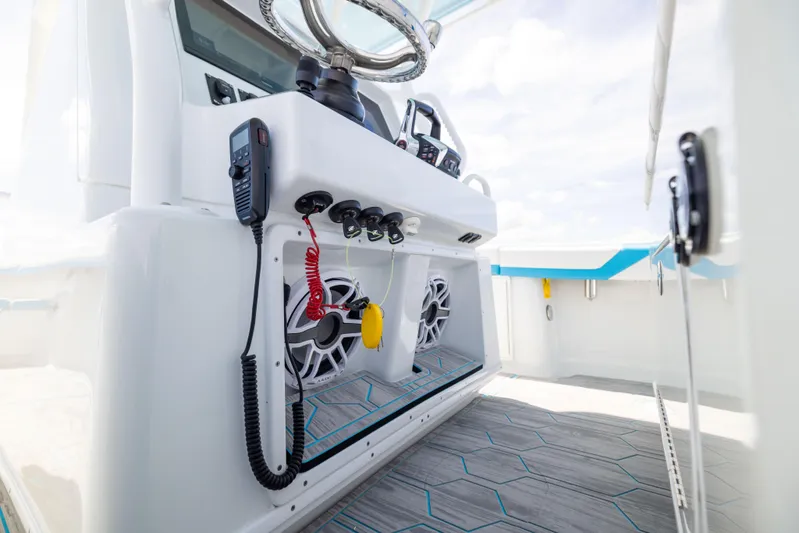  Yacht Photos Pics 2023 Yellowfin 36 Offshore boat interior with modern controls and speakers.