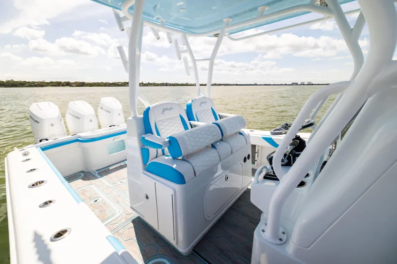  Yacht Photos Pics 2023 Yellowfin 36 Offshore boat interior with seating and multiple outboard engines.
