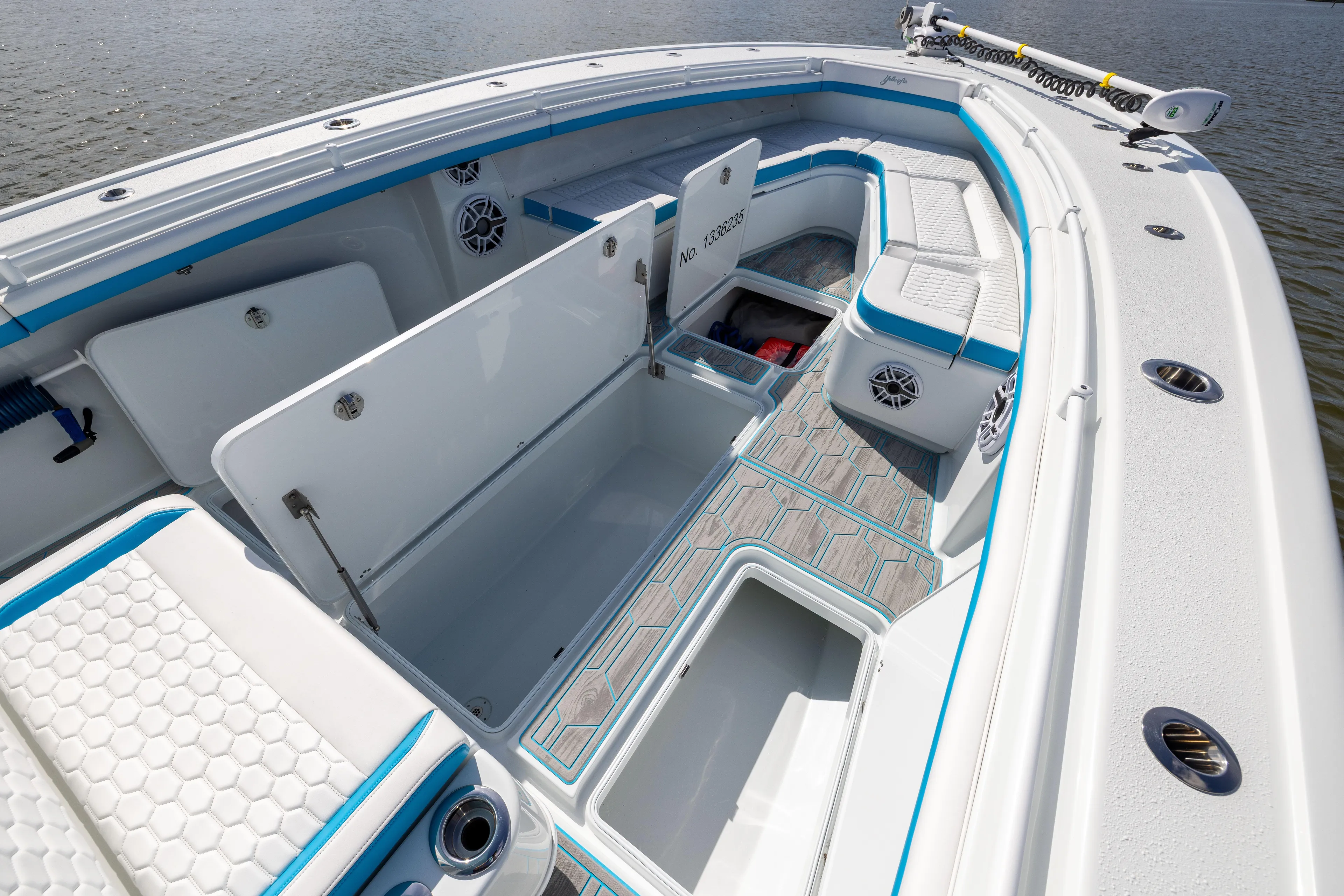  Yacht Photos Pics 2023 Yellowfin 36 Offshore boat interior with open storage compartments and seating.