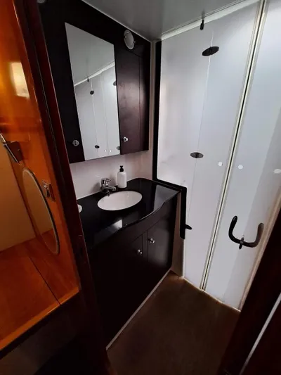 Kungaloosh Yacht Photos Pics Bathroom interior of 2010 Fountaine Pajot Cumberland 46 yacht, featuring modern fixtures.