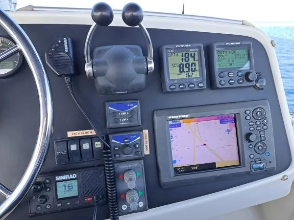 Kungaloosh Yacht Photos Pics Control panel of 2010 Fountaine Pajot Cumberland 46 with navigation and communication equipment.