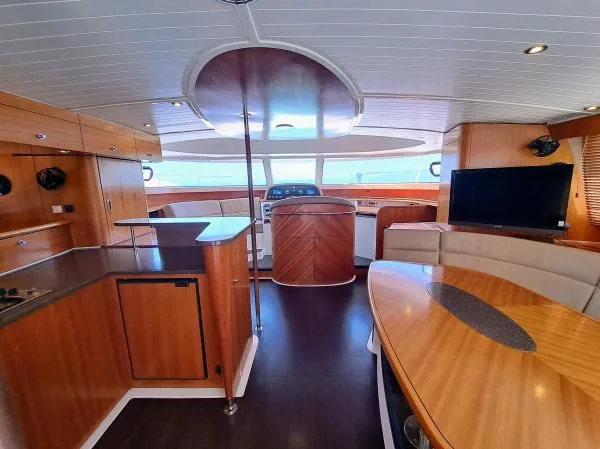 Kungaloosh Yacht Photos Pics Interior of 2010 Fountaine Pajot Cumberland 46 yacht with modern wood finish.