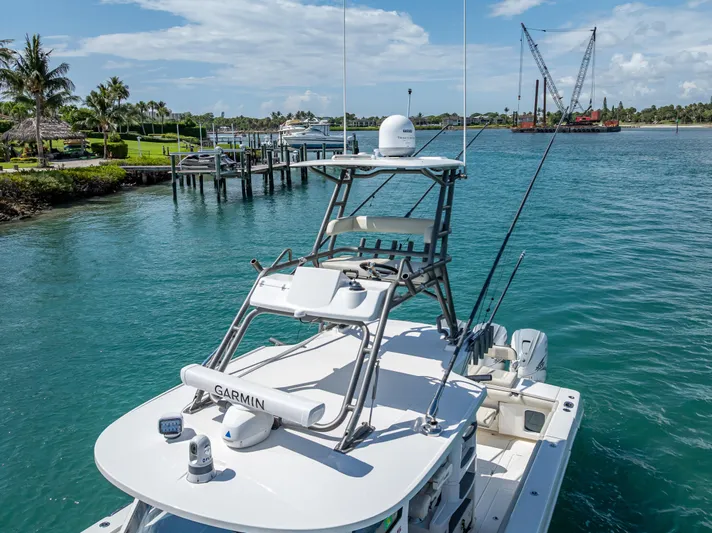 Two Roads Yacht Photos Pics 2021 Solace 41CS boat docked in a scenic marina with clear blue water.