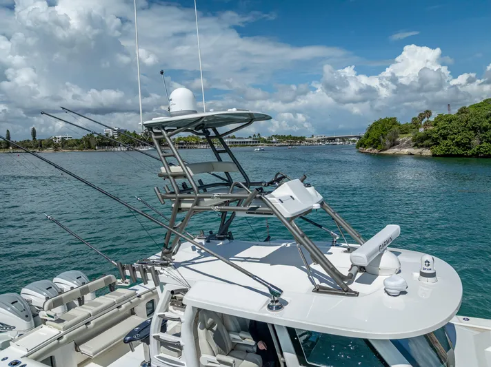 Two Roads Yacht Photos Pics 2021 Solace 41CS boat on water, featuring advanced navigation equipment and multiple outboard engines.