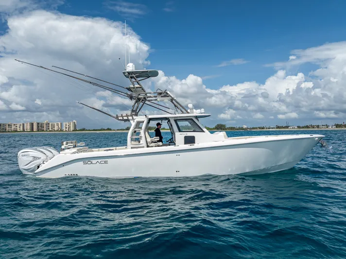 Two Roads Yacht Photos Pics 2021 Solace 41CS boat on blue ocean under cloudy sky.