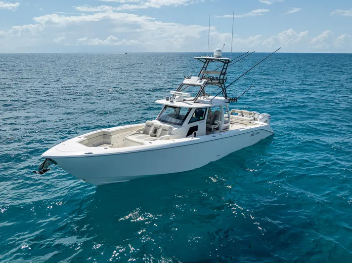 Two Roads Yacht Photos Pics 2021 Solace 41CS boat on clear blue ocean under sunny sky.