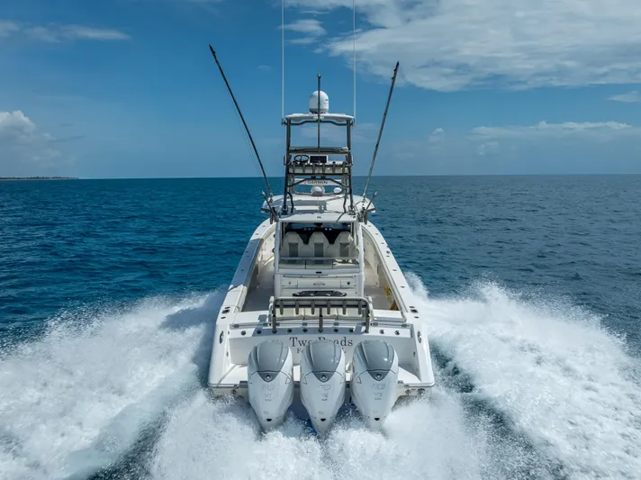 Two Roads Yacht Photos Pics Powerful Solace 41CS boat cruising on open ocean, 2021 model.