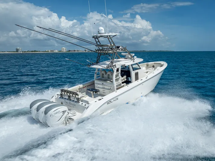 Two Roads Yacht Photos Pics 2021 Solace 41CS boat cruising on open water under a clear blue sky.