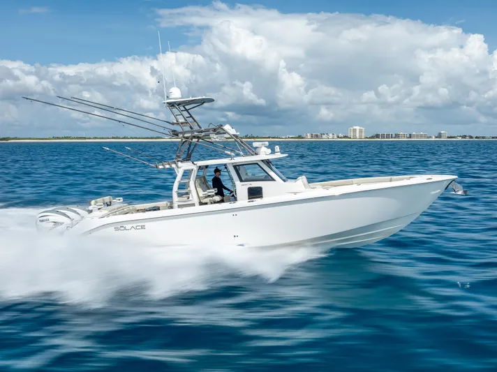 Two Roads Yacht Photos Pics 2021 Solace 41CS boat cruising on open water under a cloudy sky.