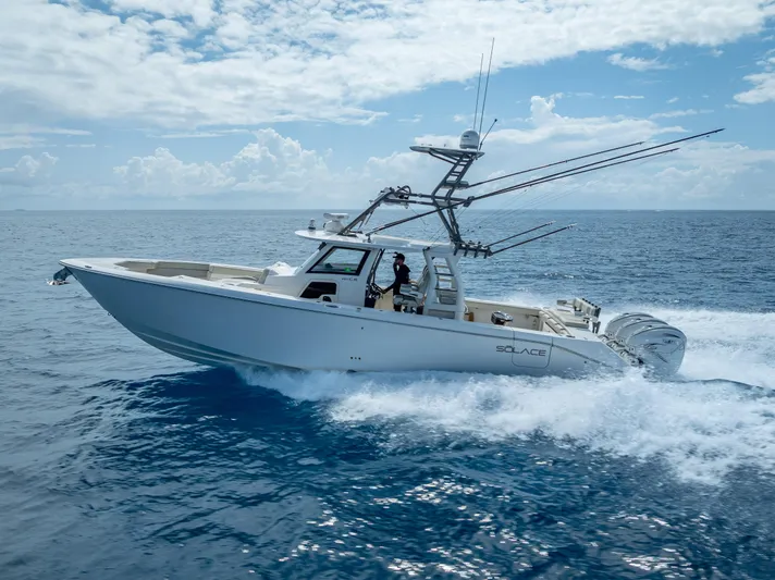 Two Roads Yacht Photos Pics 2021 Solace 41CS boat cruising on open ocean under a partly cloudy sky.