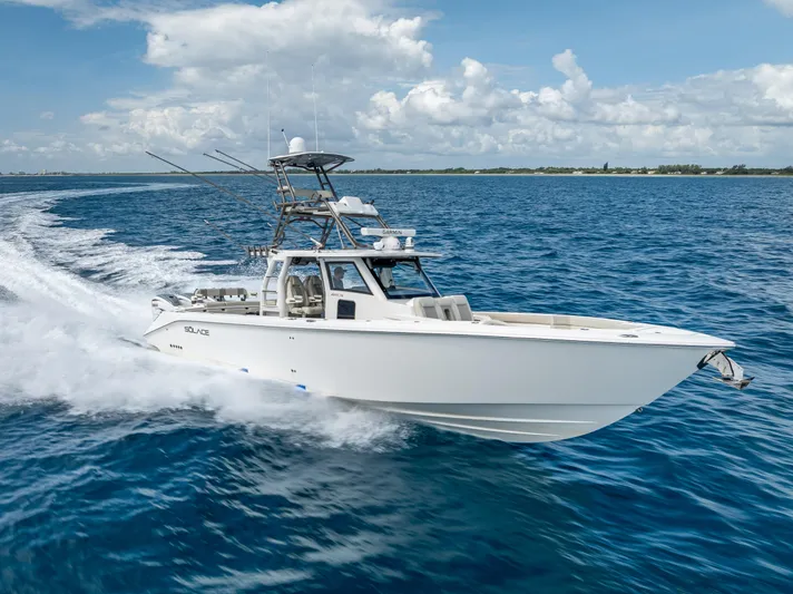 Two Roads Yacht Photos Pics 2021 Solace 41CS boat cruising on open water under a clear sky.