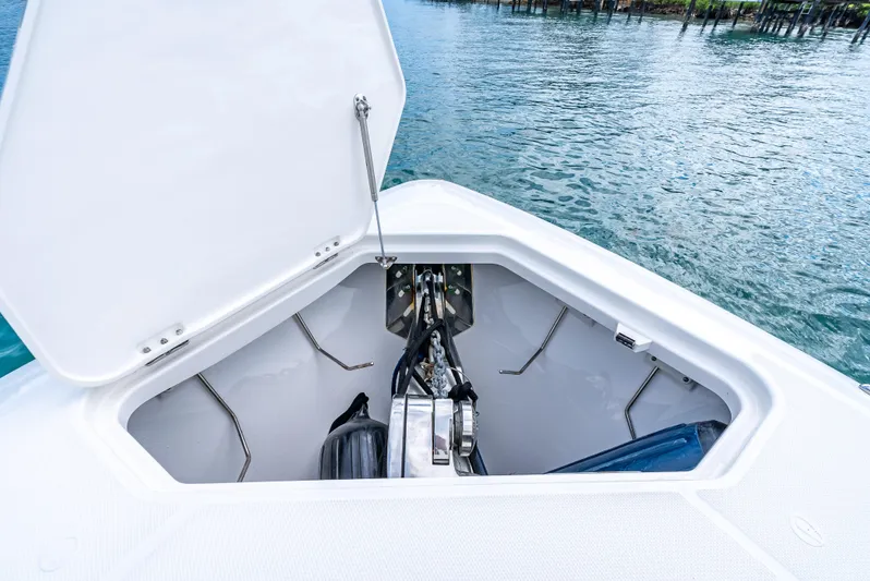 Two Roads Yacht Photos Pics Open anchor compartment on 2021 Solace 41CS boat, docked on calm water.