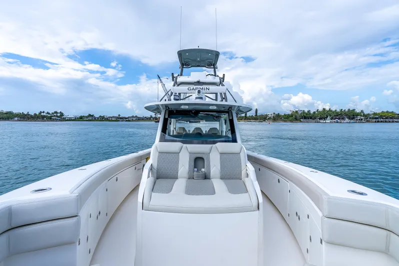 Two Roads Yacht Photos Pics 2021 Solace 41CS boat on calm water under a partly cloudy sky.
