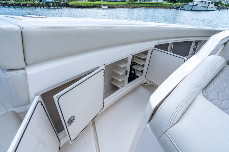 Two Roads Yacht Photos Pics 2021 Solace 41CS boat interior storage compartments with open hatches, near water.