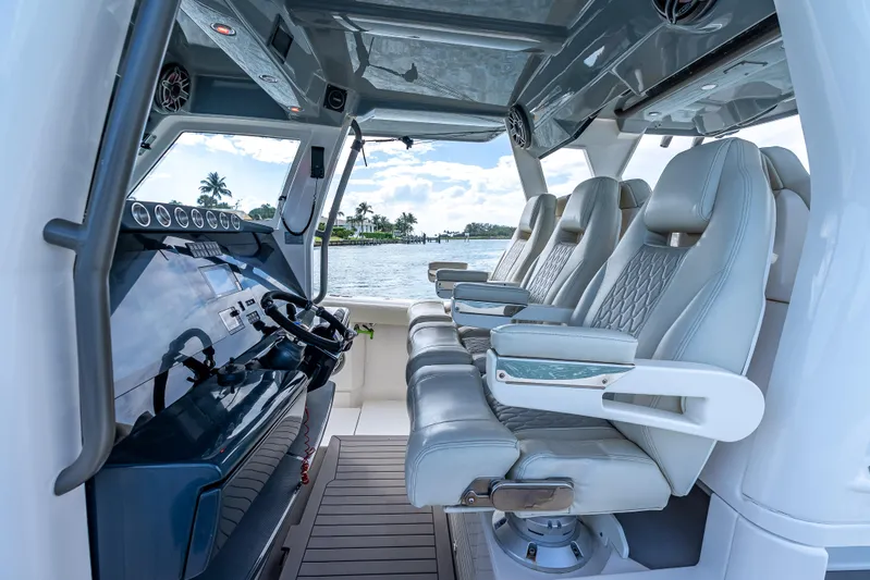 Two Roads Yacht Photos Pics Luxurious interior of 2021 Solace 41CS boat with plush seating and modern dashboard.