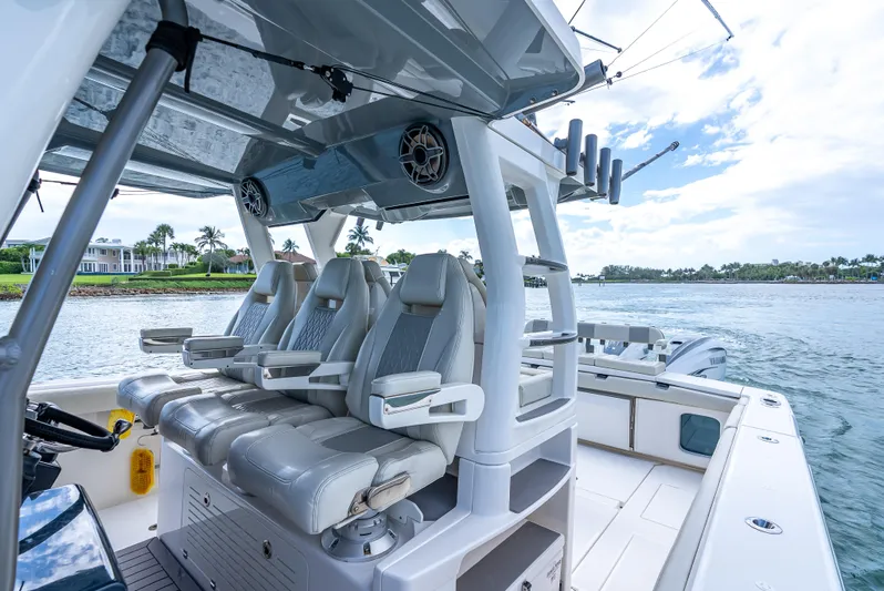 Two Roads Yacht Photos Pics Luxury seating on 2021 Solace 41CS boat, featuring sleek design and ocean backdrop.