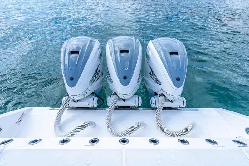Two Roads Yacht Photos Pics Triple V8 engines on a 2021 Solace 41CS boat, floating on clear blue water.