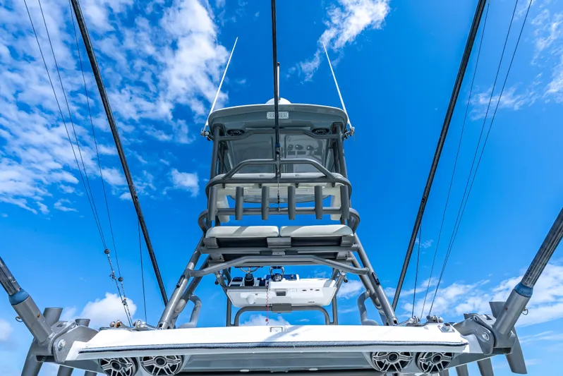 Two Roads Yacht Photos Pics Solace 41CS 2021 boat tower against a vibrant blue sky with clouds.
