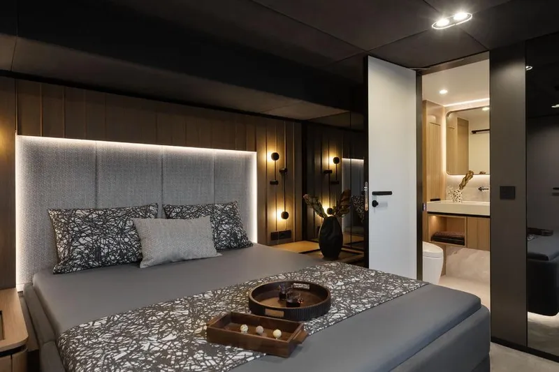  Yacht Photos Pics Luxurious bedroom interior on 2025 Sunreef Yachts 80 Eco, featuring modern design and ambient lighting.