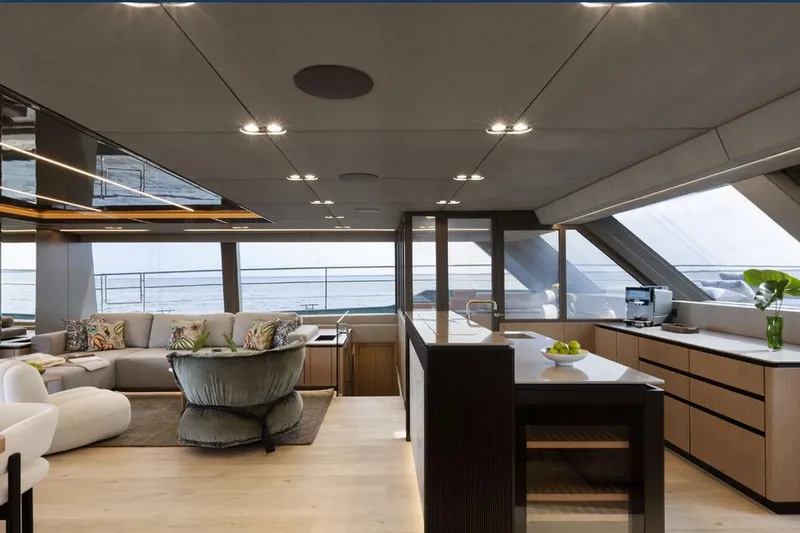  Yacht Photos Pics Luxurious interior of 2025 Sunreef Yachts 80 Eco, featuring modern kitchen and seating area.