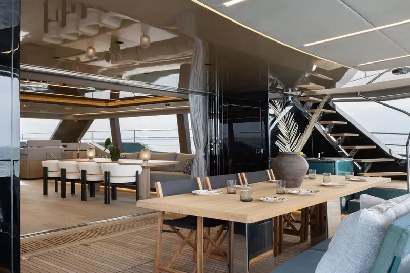  Yacht Photos Pics Luxurious interior of 2025 Sunreef Yachts 80 Eco, featuring elegant dining and seating areas.