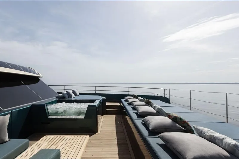  Yacht Photos Pics Luxurious Sunreef Yachts 80 Eco 2025 with spacious deck and jacuzzi, overlooking serene ocean.