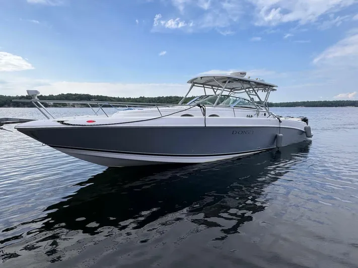  Yacht Photos Pics 2008 Donzi 38 ZSF boat on calm water under a clear blue sky.