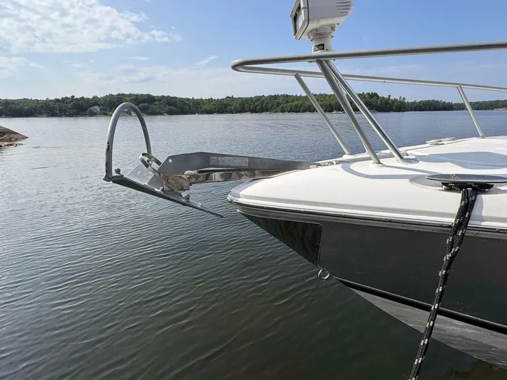  Yacht Photos Pics 2008 Donzi 38 ZSF boat with anchor, docked on calm water.