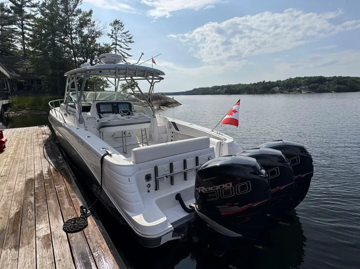  Yacht Photos Pics 2008 Donzi 38 ZSF boat docked, featuring triple Mercury Racing 300 engines and a Canadian flag.