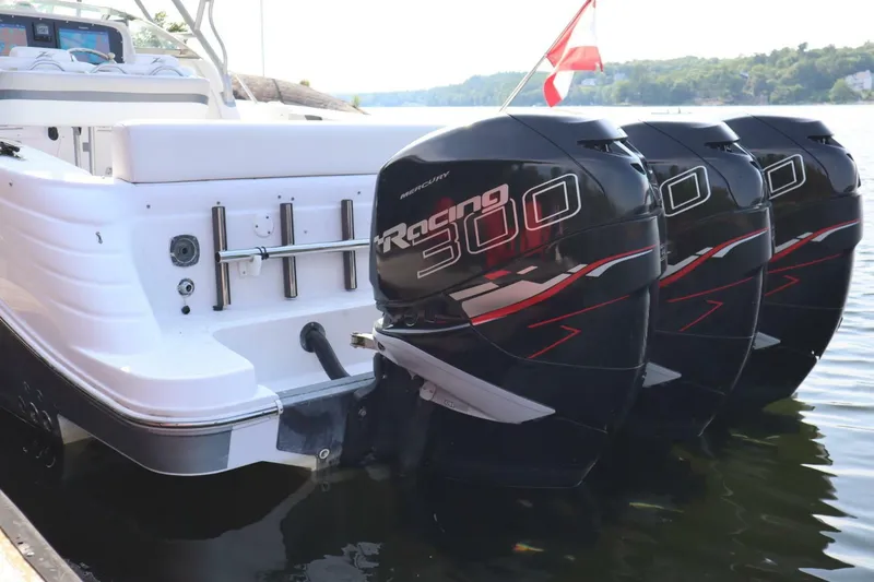  Yacht Photos Pics 2008 Donzi 38 ZSF boat with triple Mercury Racing 300 engines docked on water.