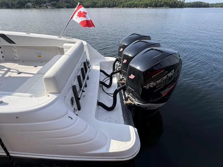  Yacht Photos Pics 2008 Donzi 38 ZSF boat with twin Mercury Racing 300 engines and Canadian flag on calm water.