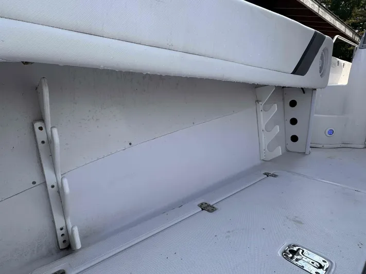  Yacht Photos Pics 2008 Donzi 38 ZSF boat interior, featuring white upholstery and storage compartments.