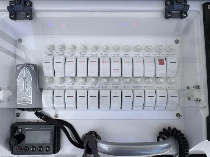  Yacht Photos Pics Control panel of a 2008 Donzi 38 ZSF boat with labeled switches and remote.