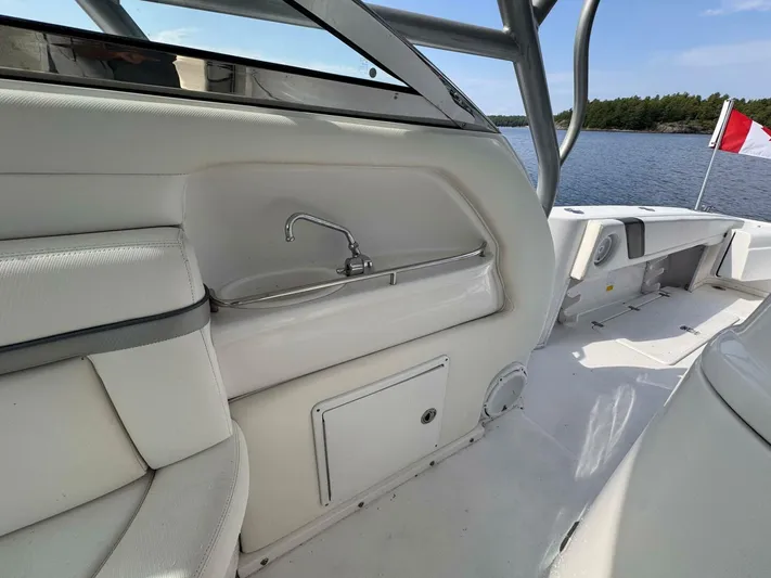  Yacht Photos Pics 2008 Donzi 38 ZSF boat interior with sink, white seating, and lake view.