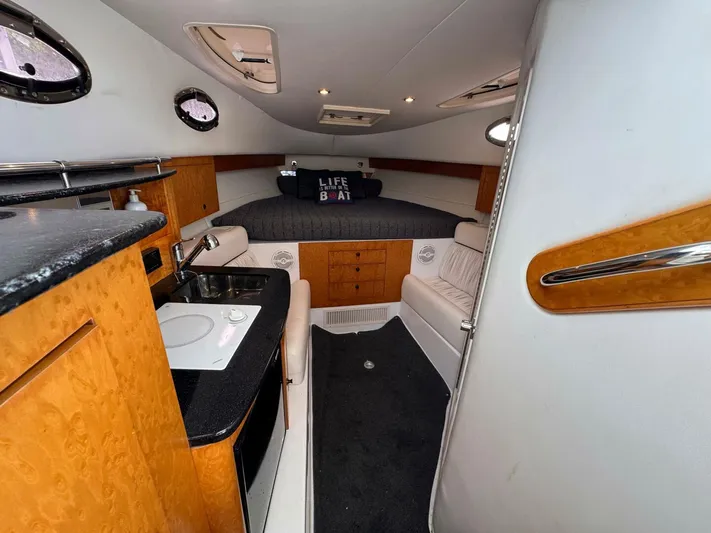  Yacht Photos Pics 2008 Donzi 38 ZSF cabin interior with kitchenette, seating, and bed.